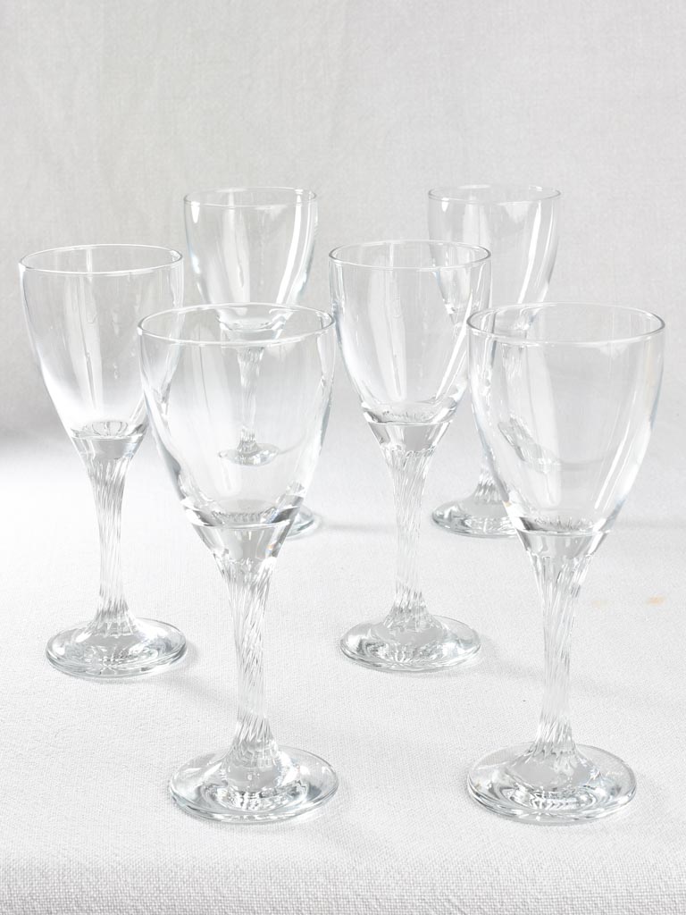 Six wine glasses with twisted stems