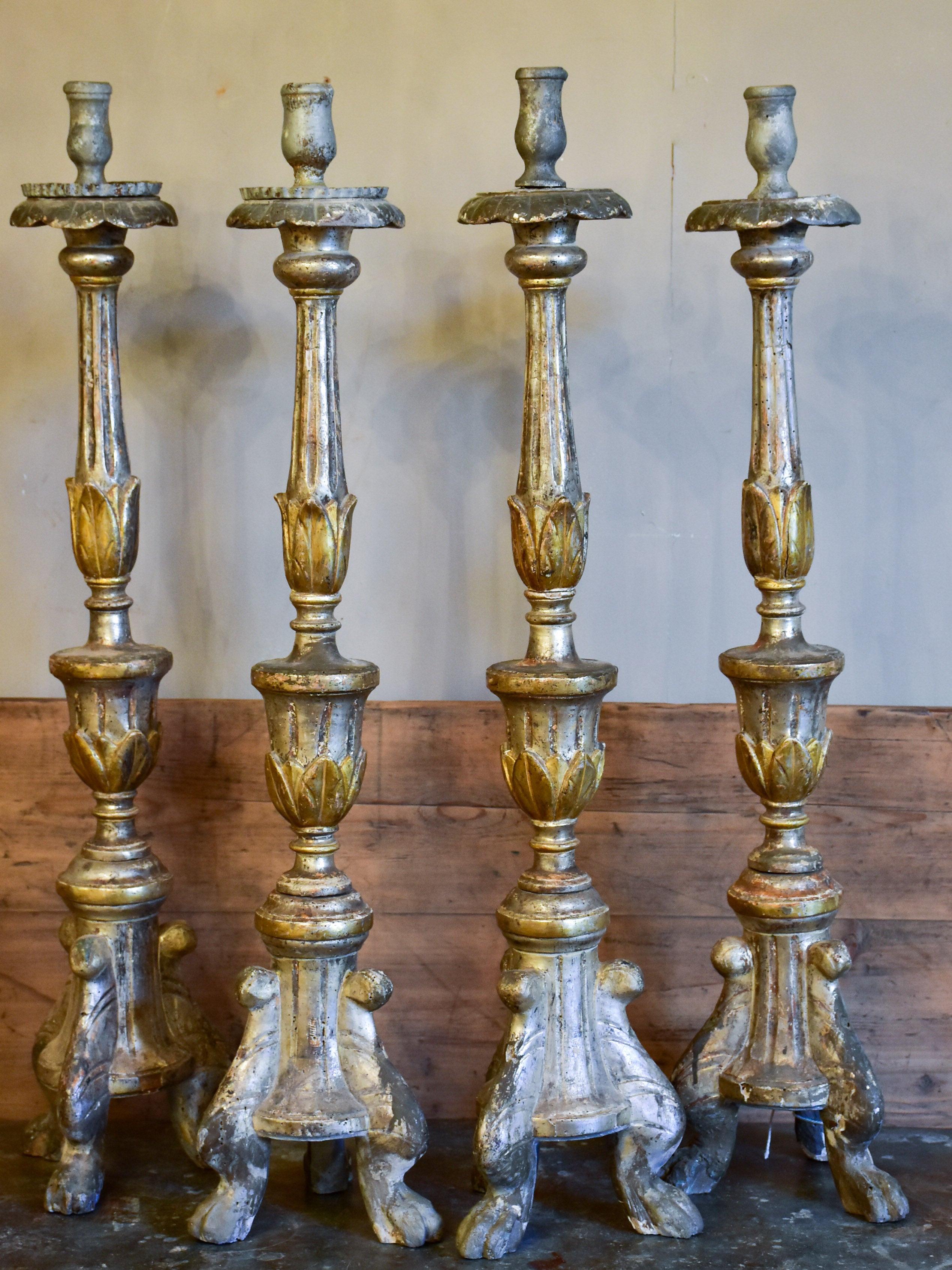 Four large antique Italian church candlesticks