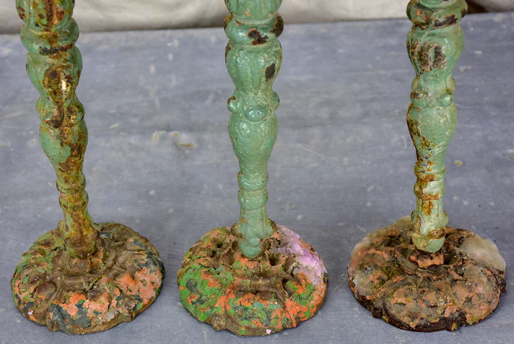 Three antique French candlesticks made from salvaged spindles