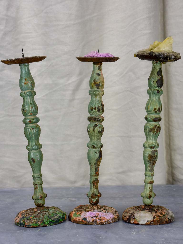 Three antique French candlesticks made from salvaged spindles