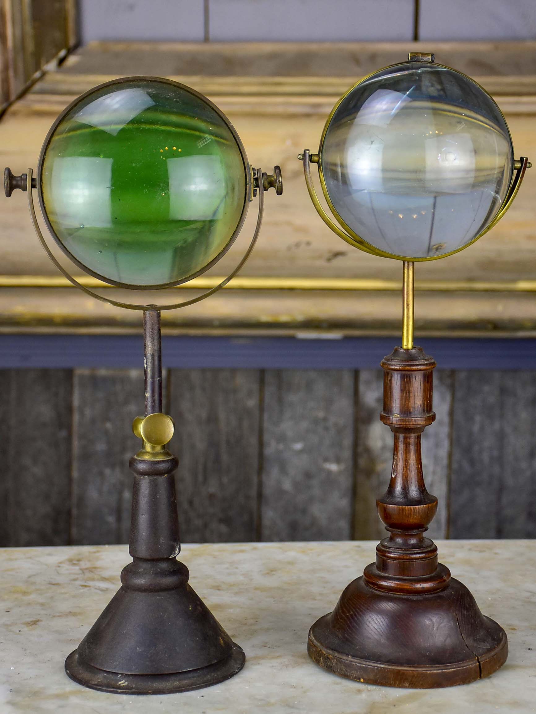 Pair of antique French magnifying loupes on stands