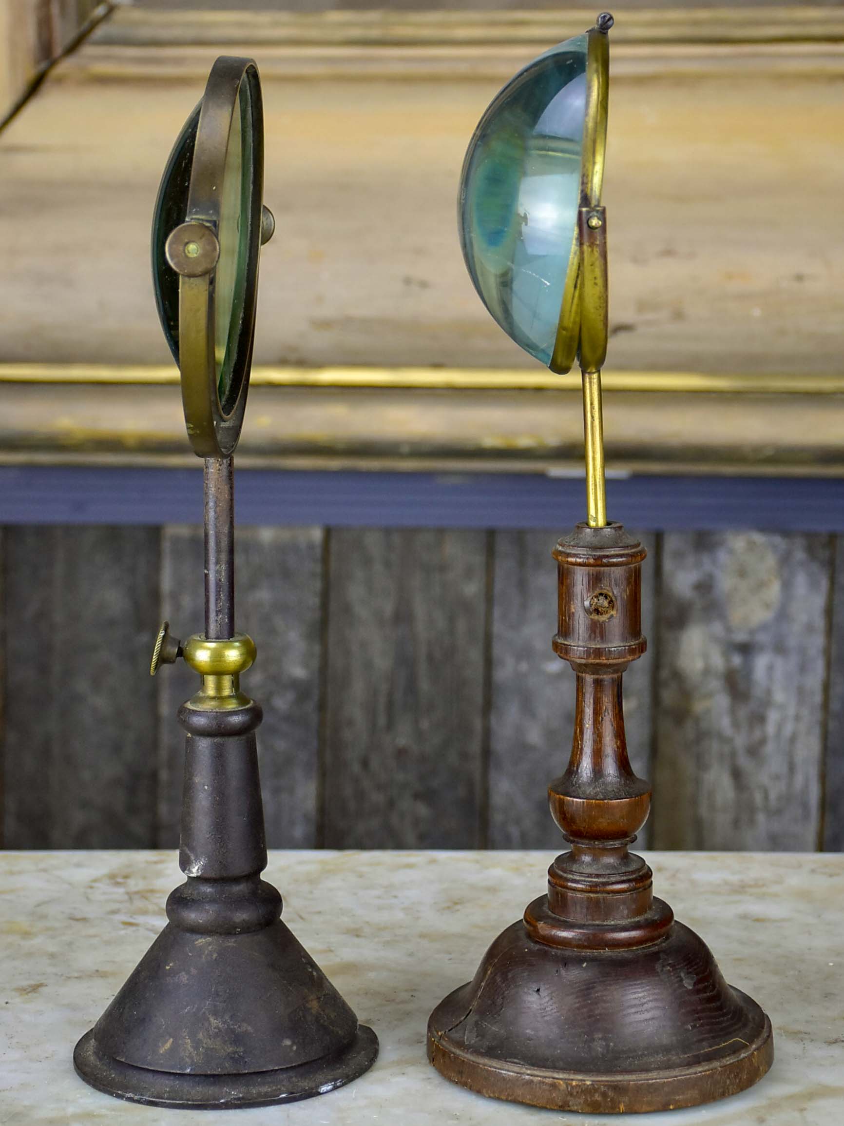 Pair of antique French magnifying loupes on stands