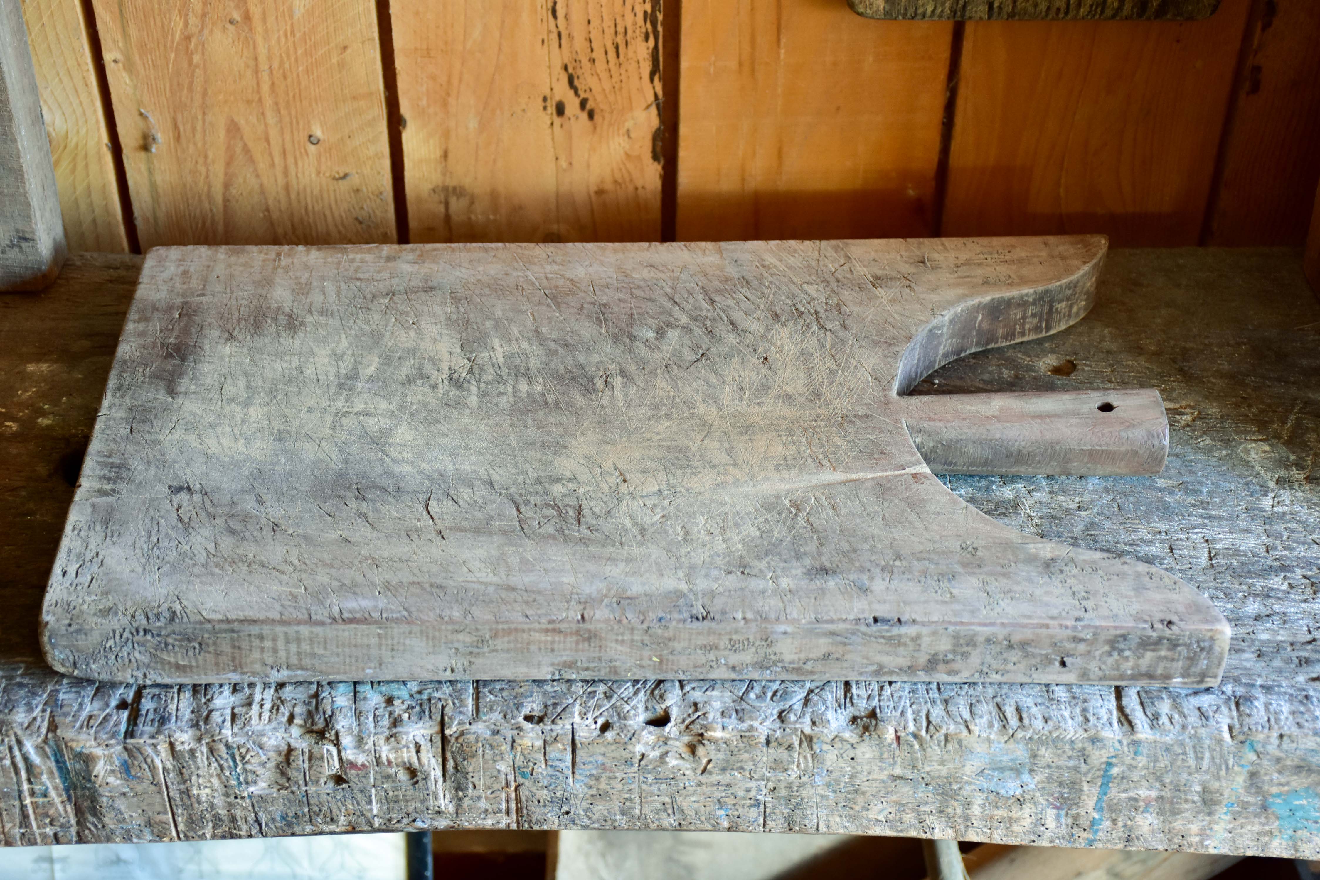 Antique French cutting board with peaked shoulders