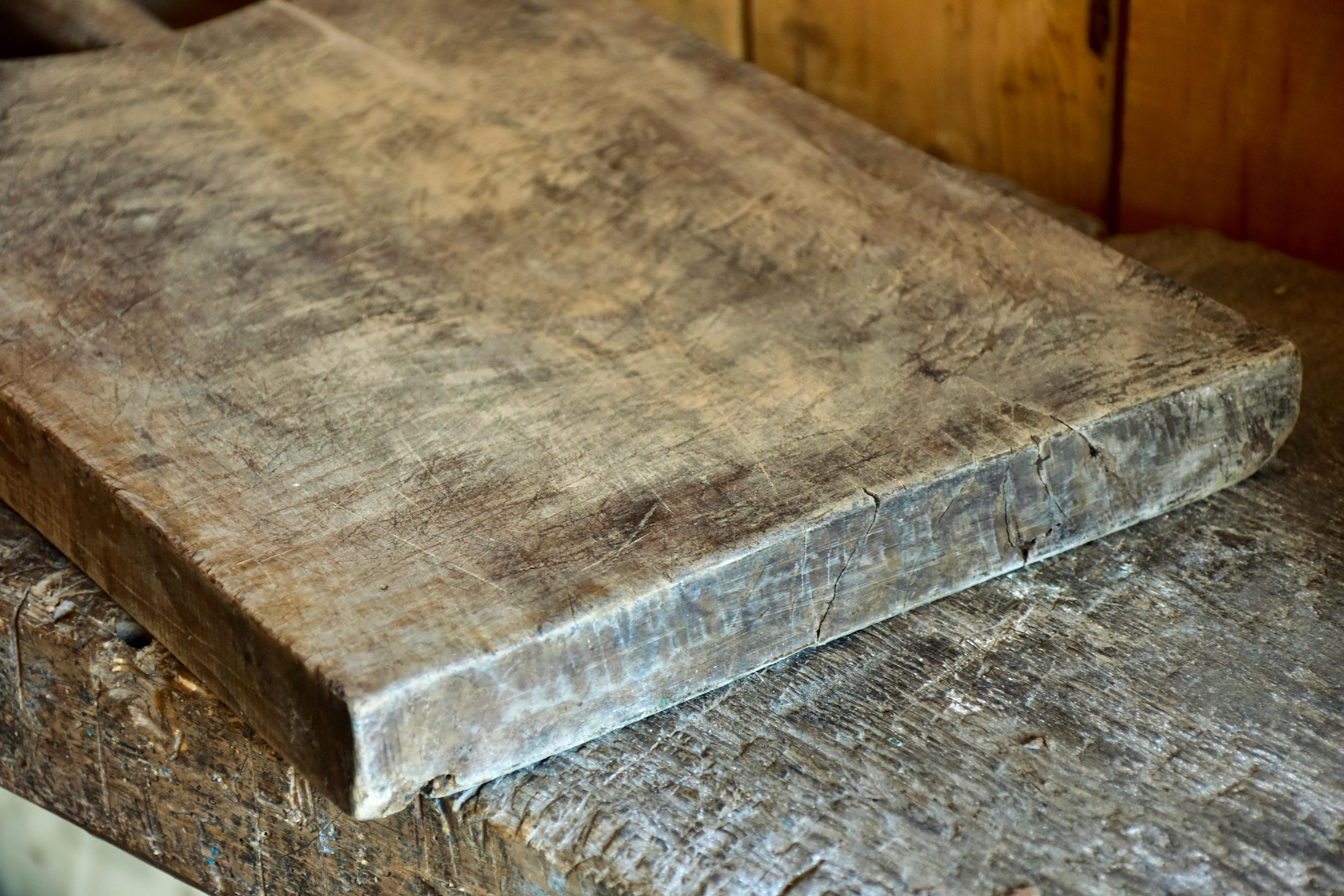 Antique French cutting board with peaked shoulders