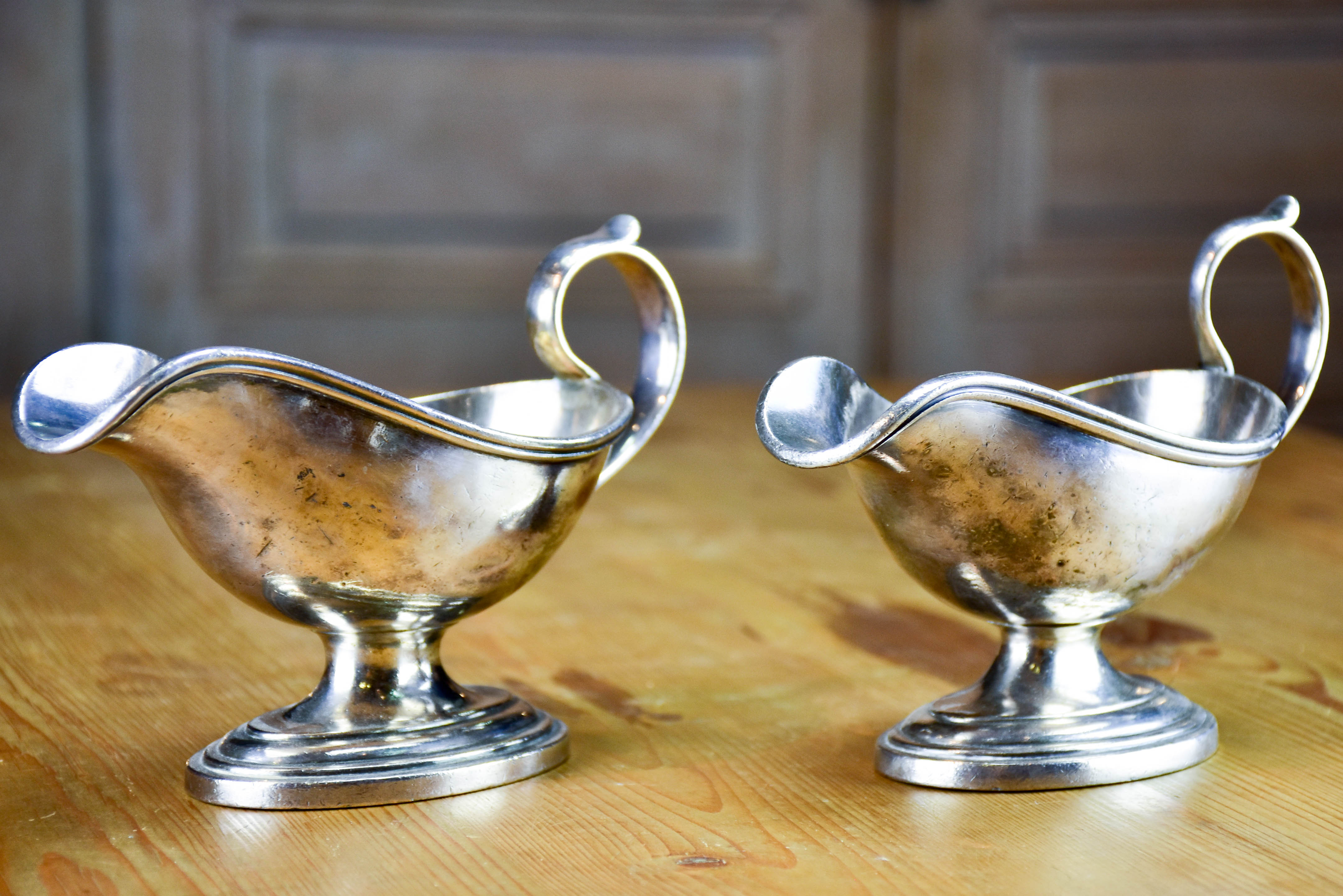 Two antique French sauce boats with monogram