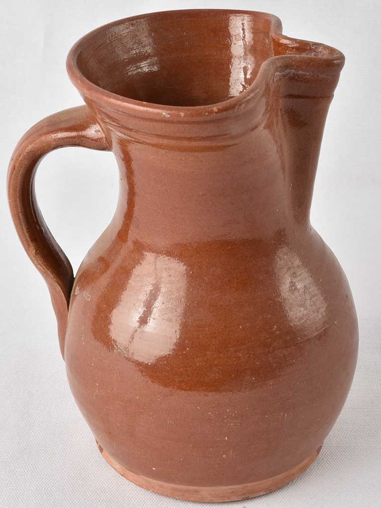 1970s terracotta pitcher w/ brown glaze 9½"