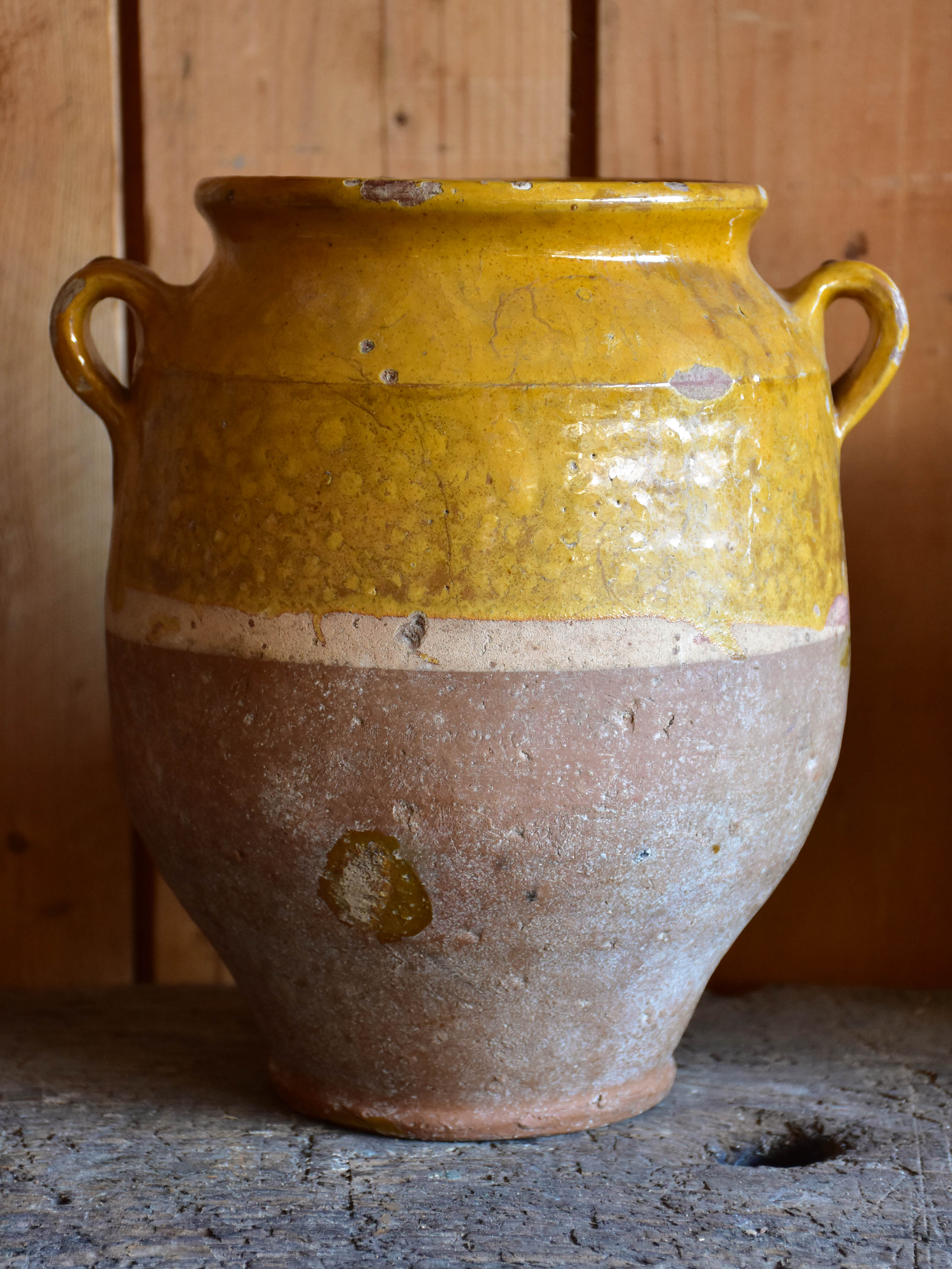 Three antique French confit pots with orange glaze