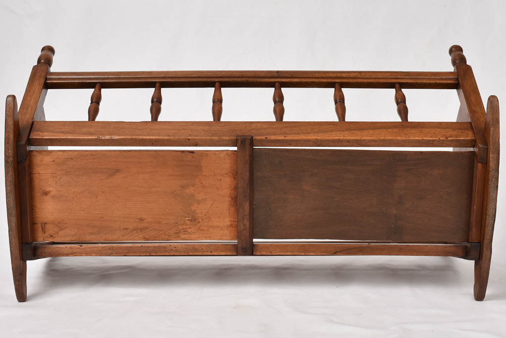 Generationally-used walnut baby cradle