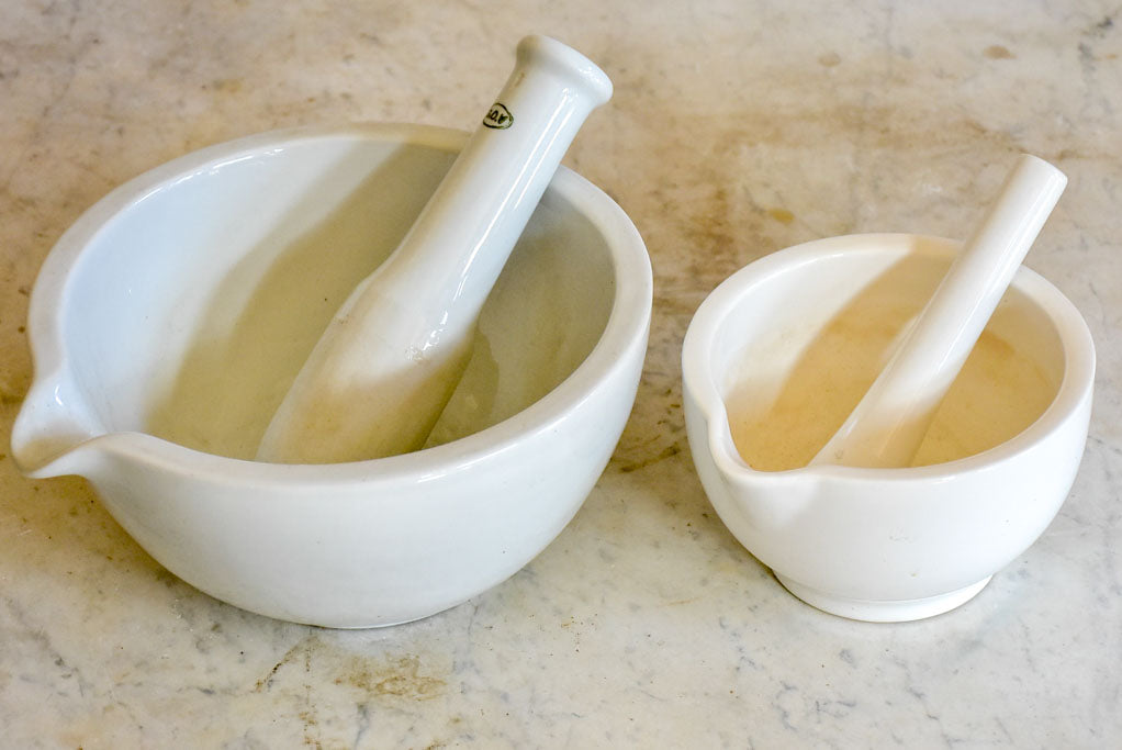 Two small antique French pharmacy mortar and pestles