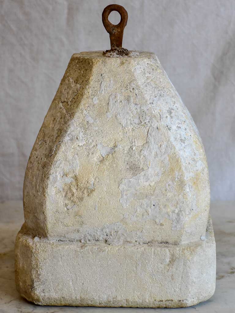 Two antique French stone counterweights