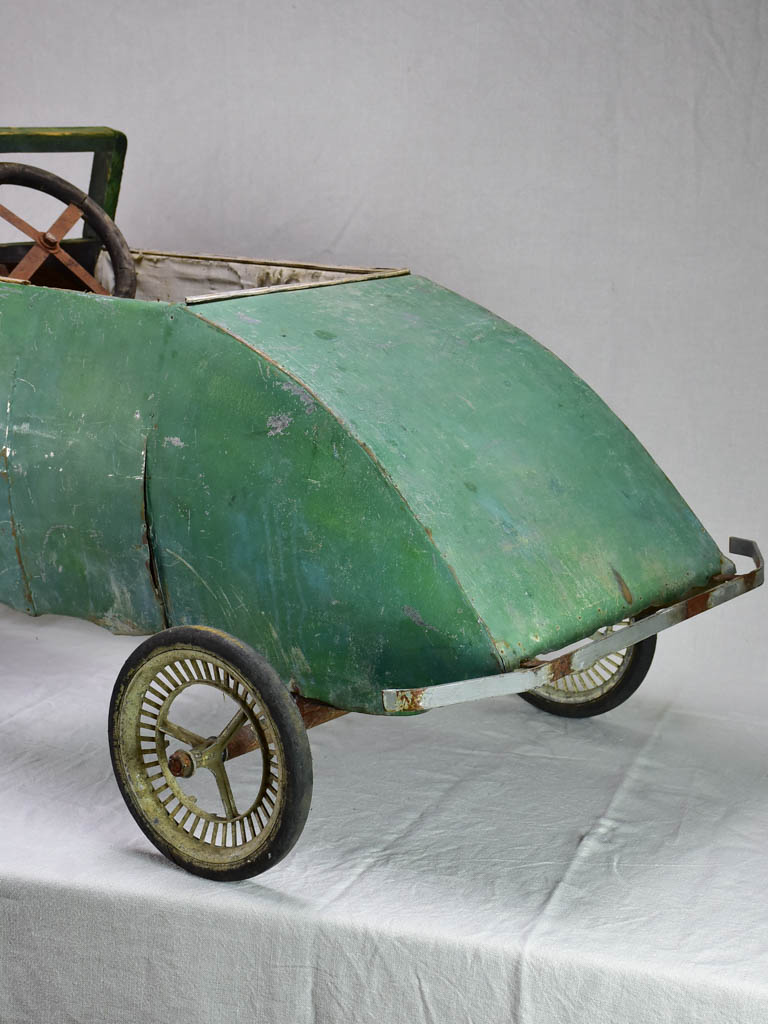 Rare green toy push car from the mid-twentieth century 61"