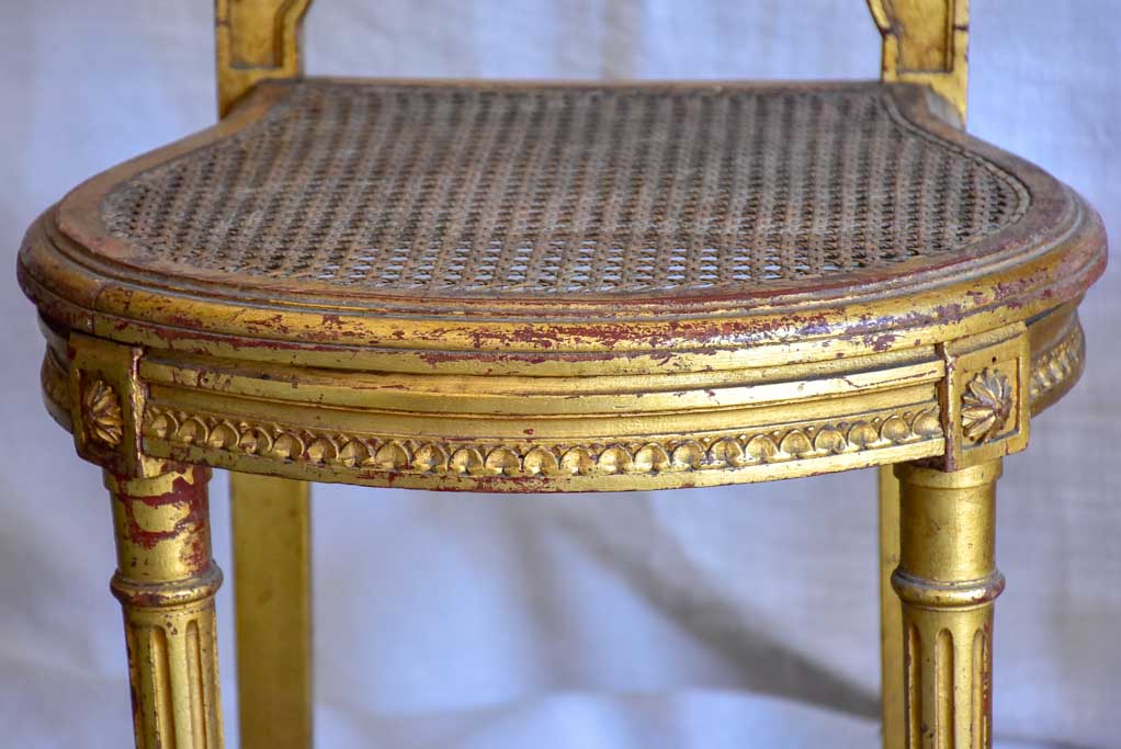 Pair of 18th Century Louis XVI gilded cane chairs