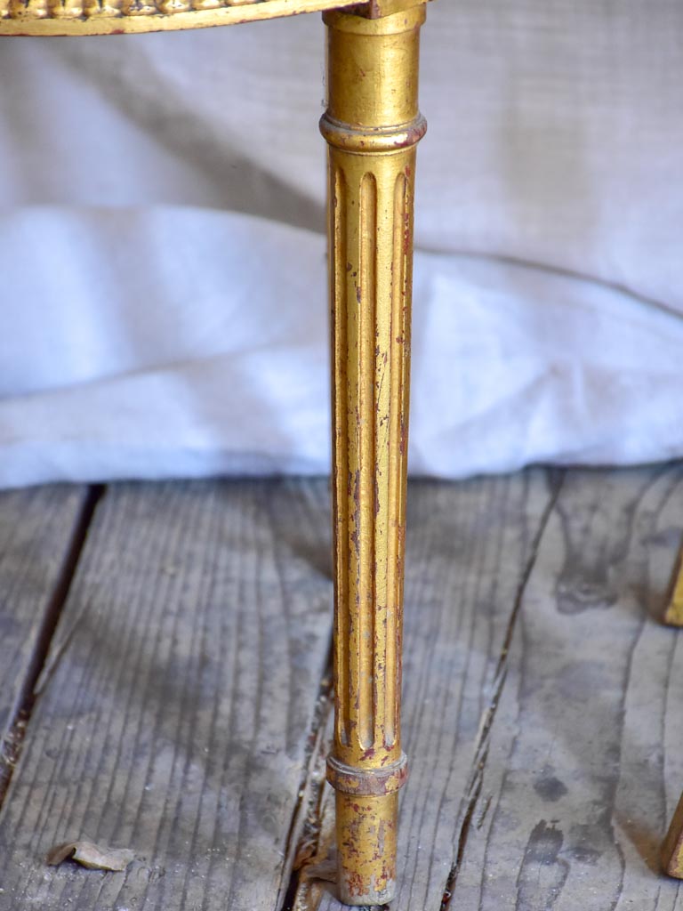 Pair of 18th Century Louis XVI gilded cane chairs