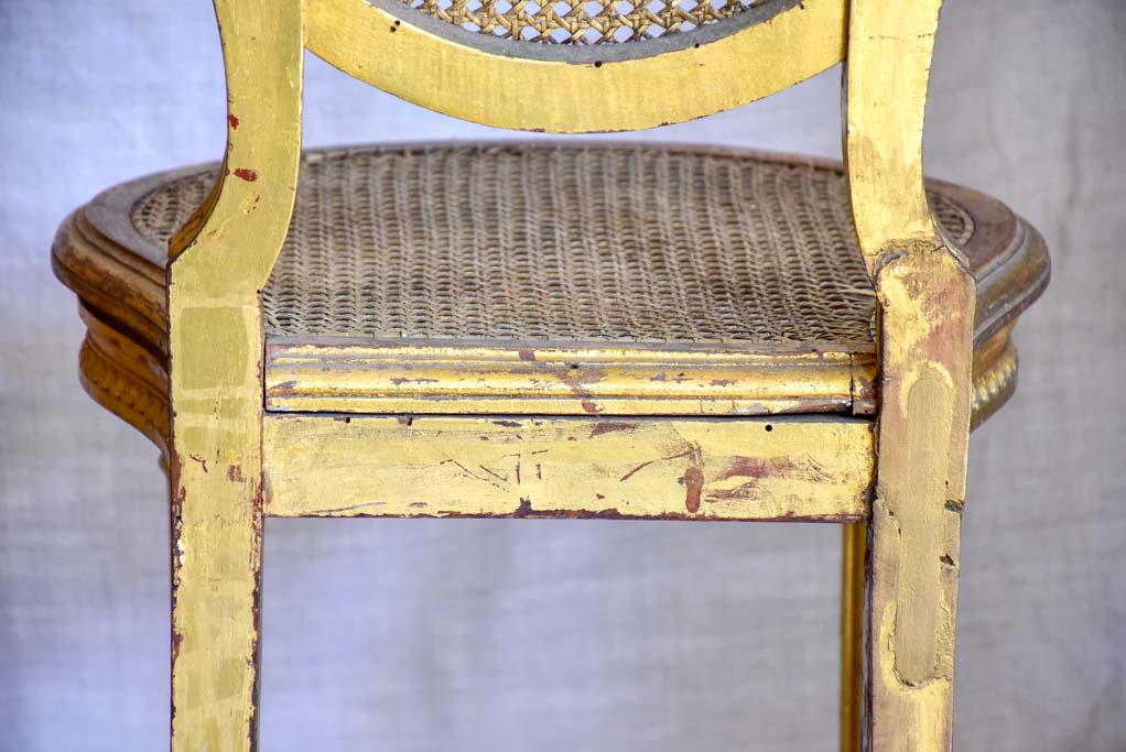 Pair of 18th Century Louis XVI gilded cane chairs