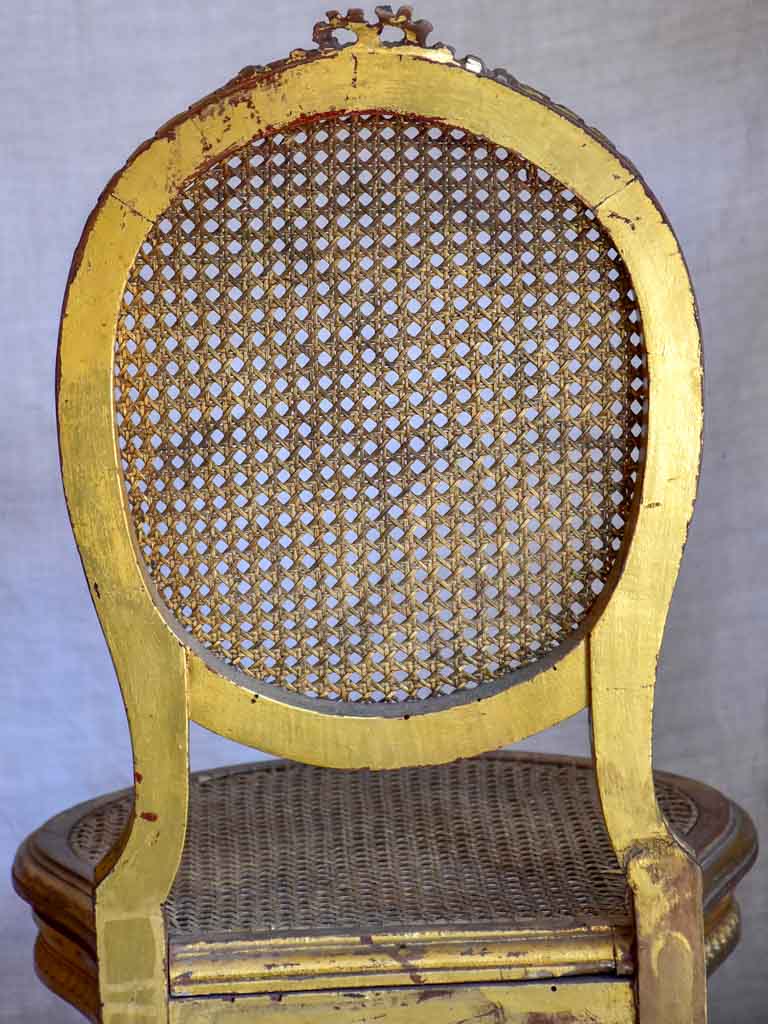 Pair of 18th Century Louis XVI gilded cane chairs