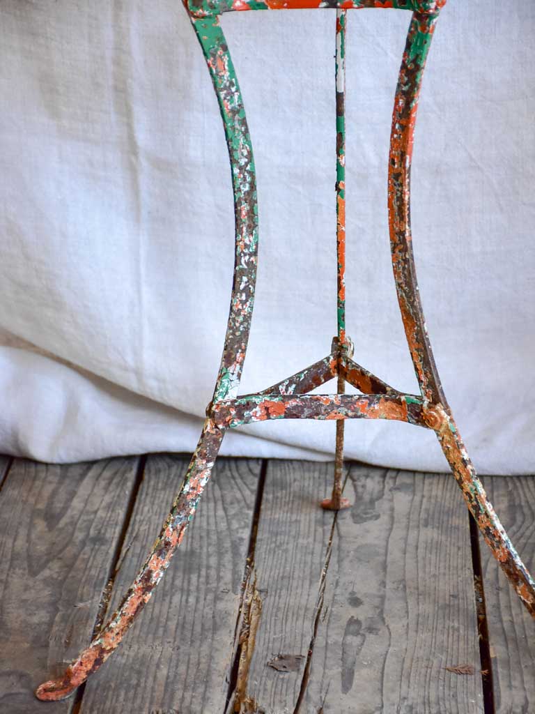 Rustic French garden table with weathered green and orange patina