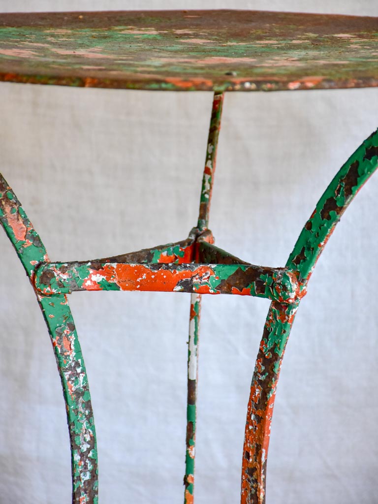 Rustic French garden table with weathered green and orange patina