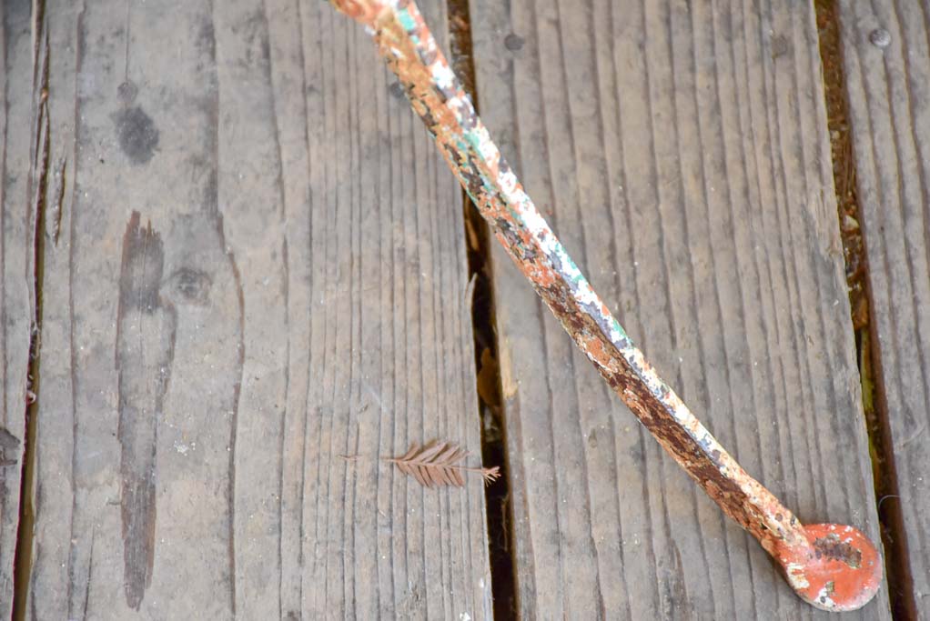 Rustic French garden table with weathered green and orange patina