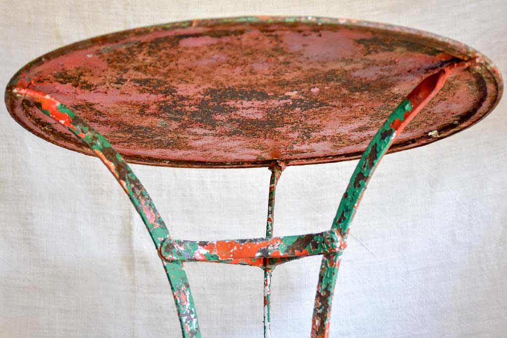 Rustic French garden table with weathered green and orange patina