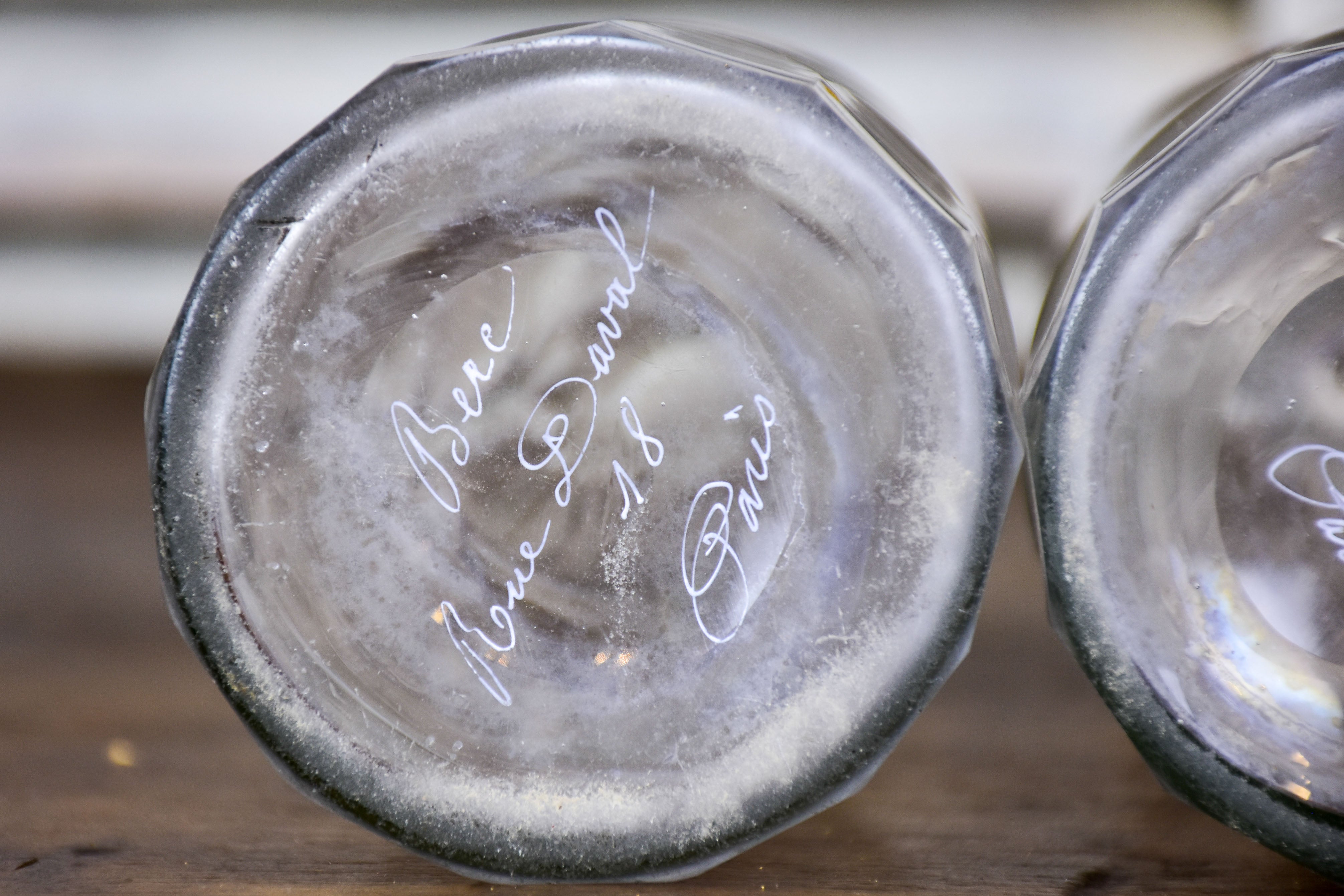 Three antique Parisian bistro bottles - signed