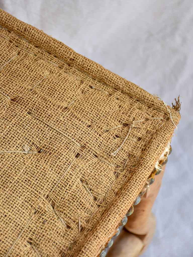 Rustic antique French stool with jute upholstery