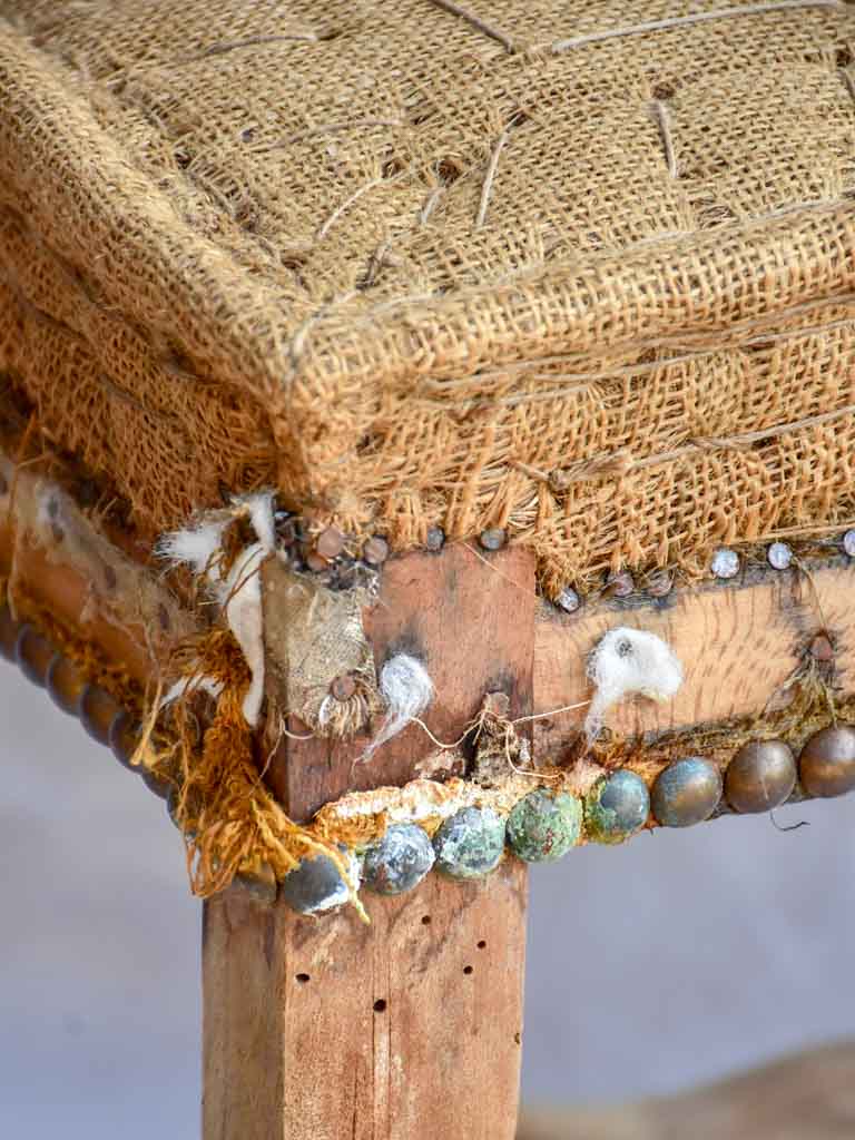 Rustic antique French stool with jute upholstery