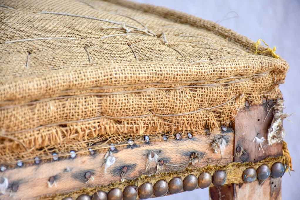 Rustic antique French stool with jute upholstery