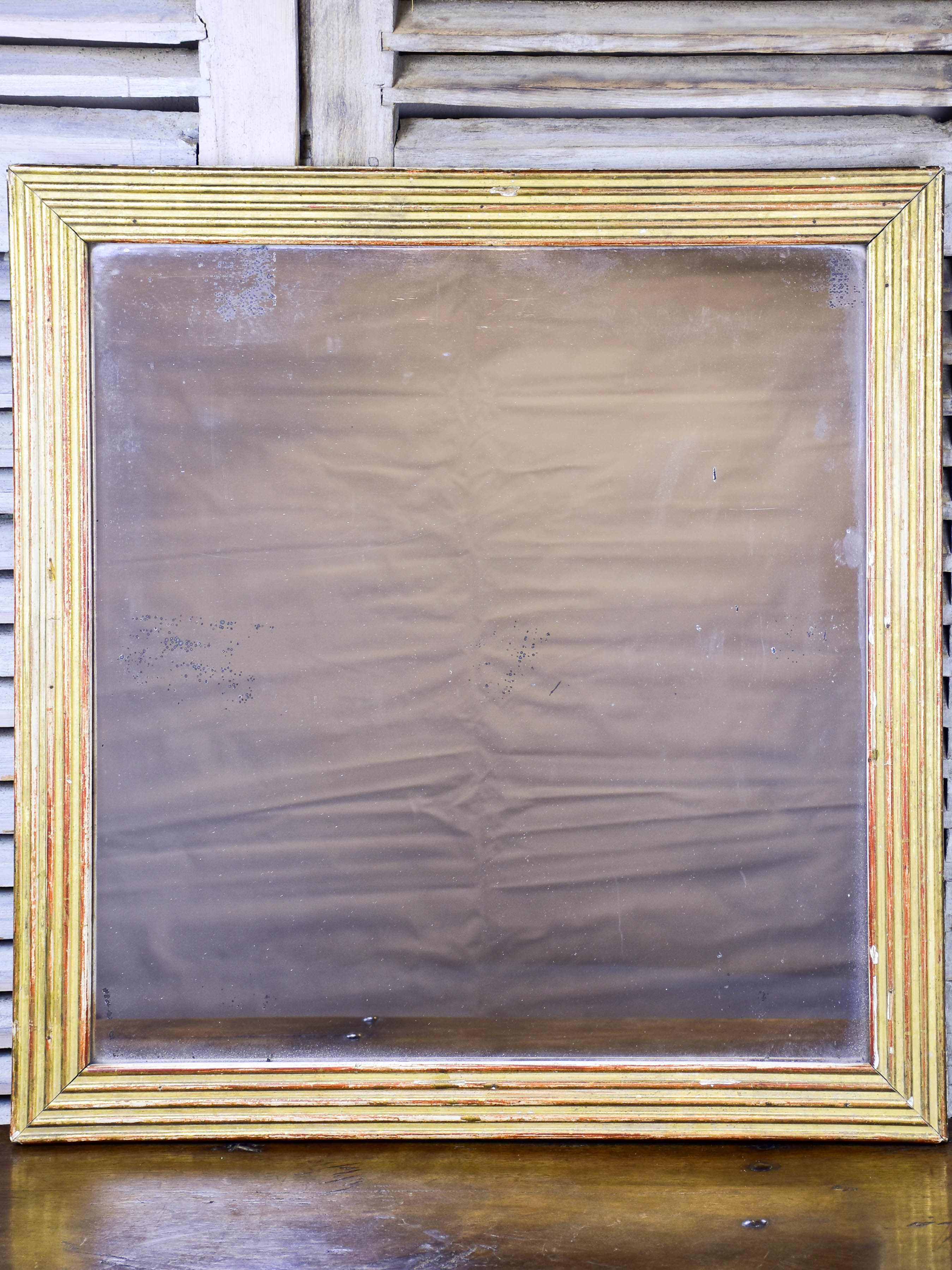 18th century Louis XVI giltwood mirror with reeded frame 33 ½'' x 32 ½''