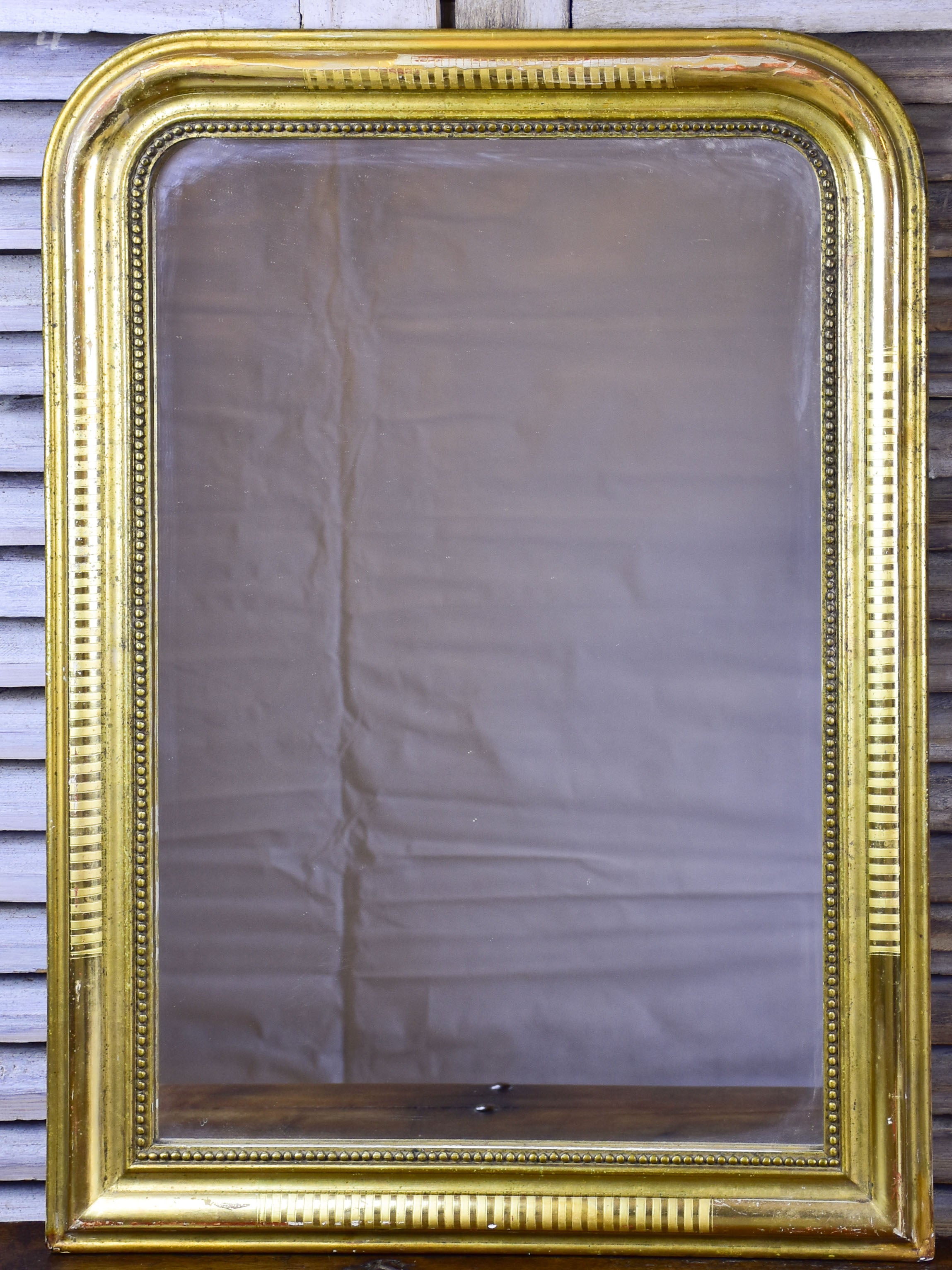 Antique French Louis Philippe mirror with gilded frame