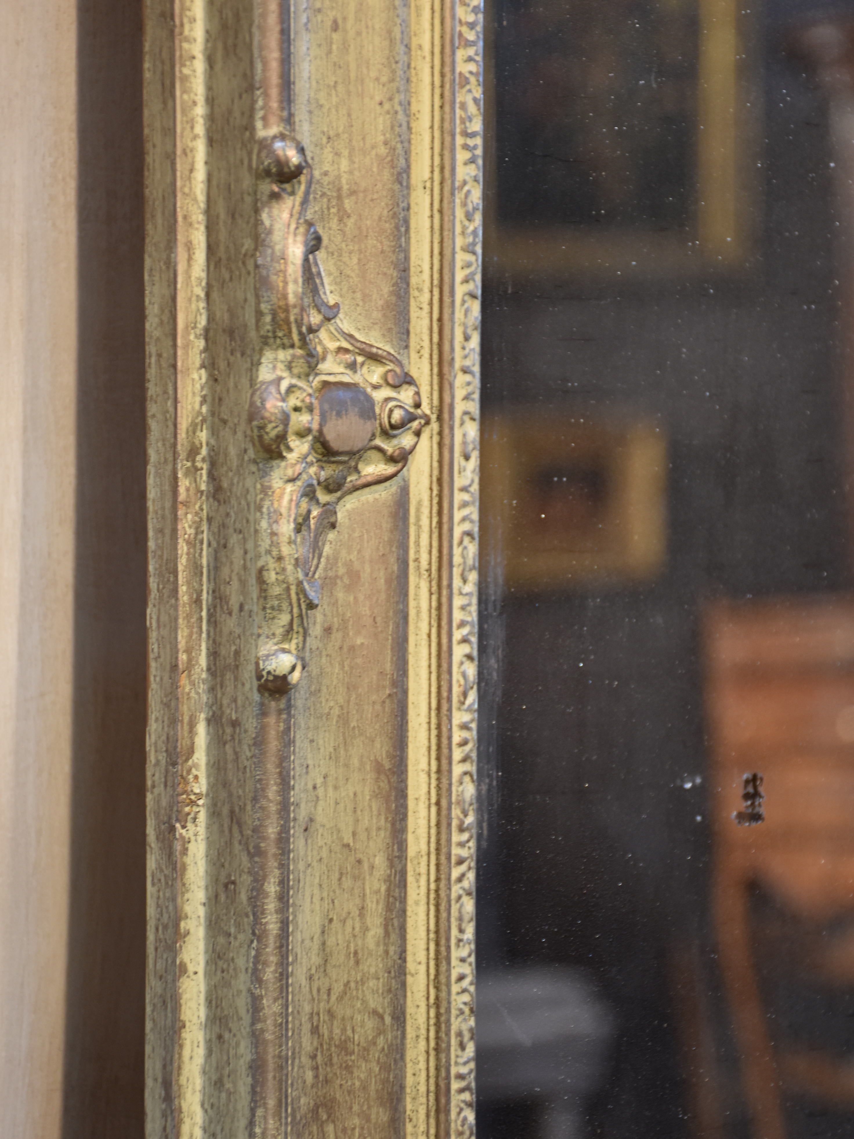 Antique French mirror with decorative frame