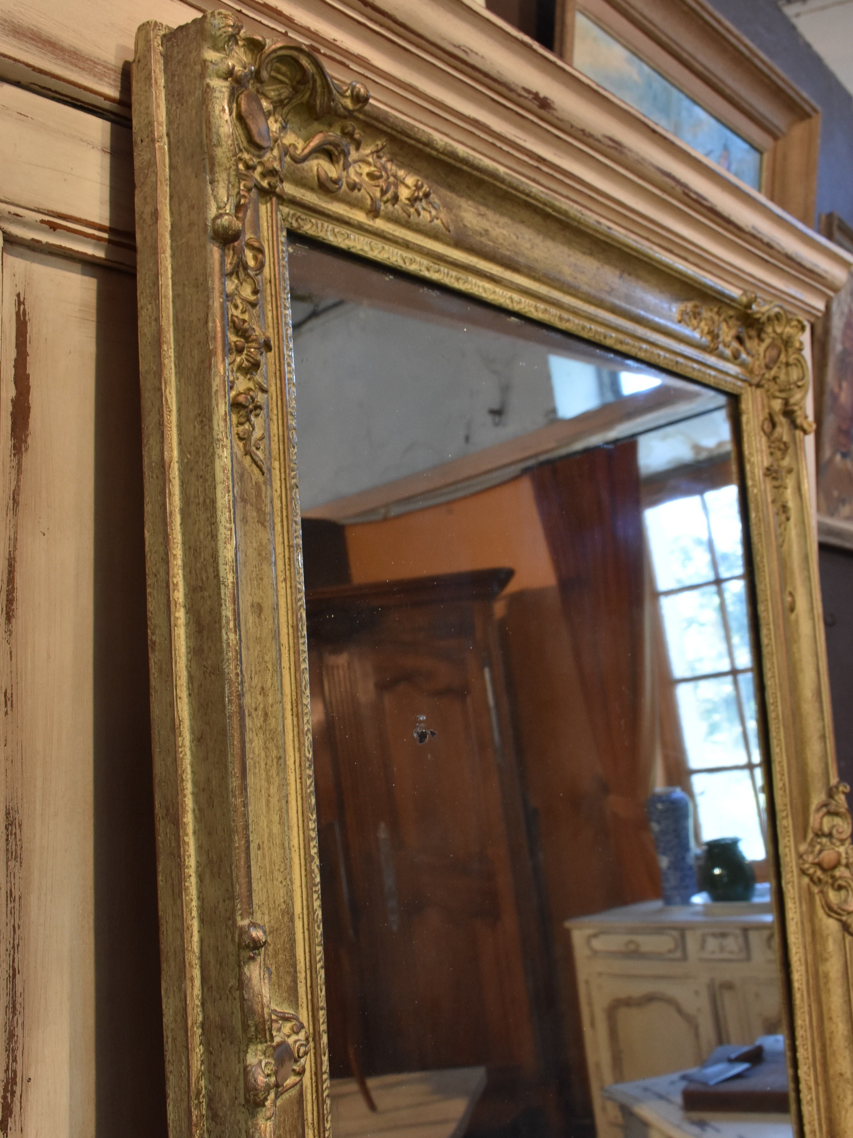 Antique French mirror with decorative frame