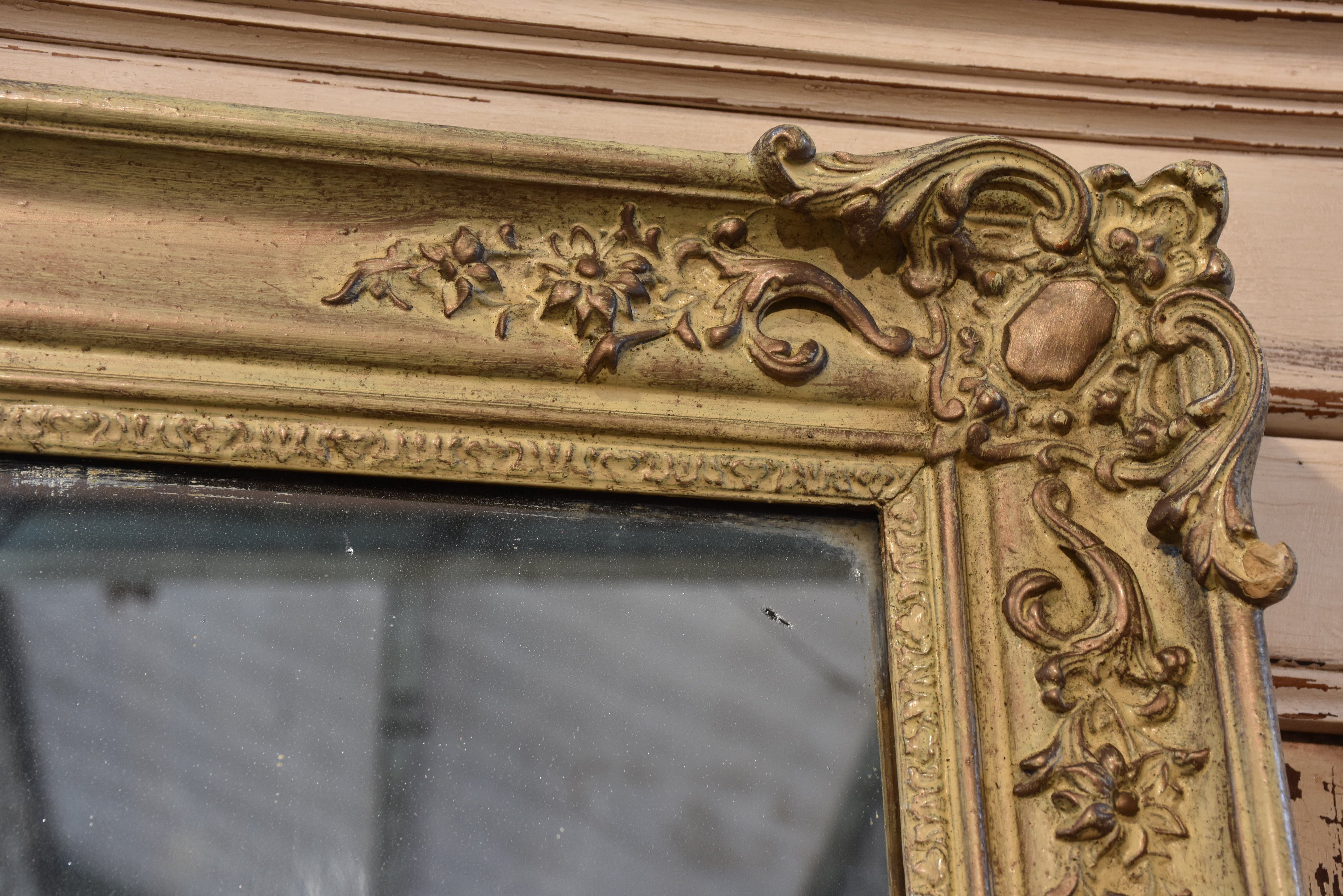 Antique French mirror with decorative frame