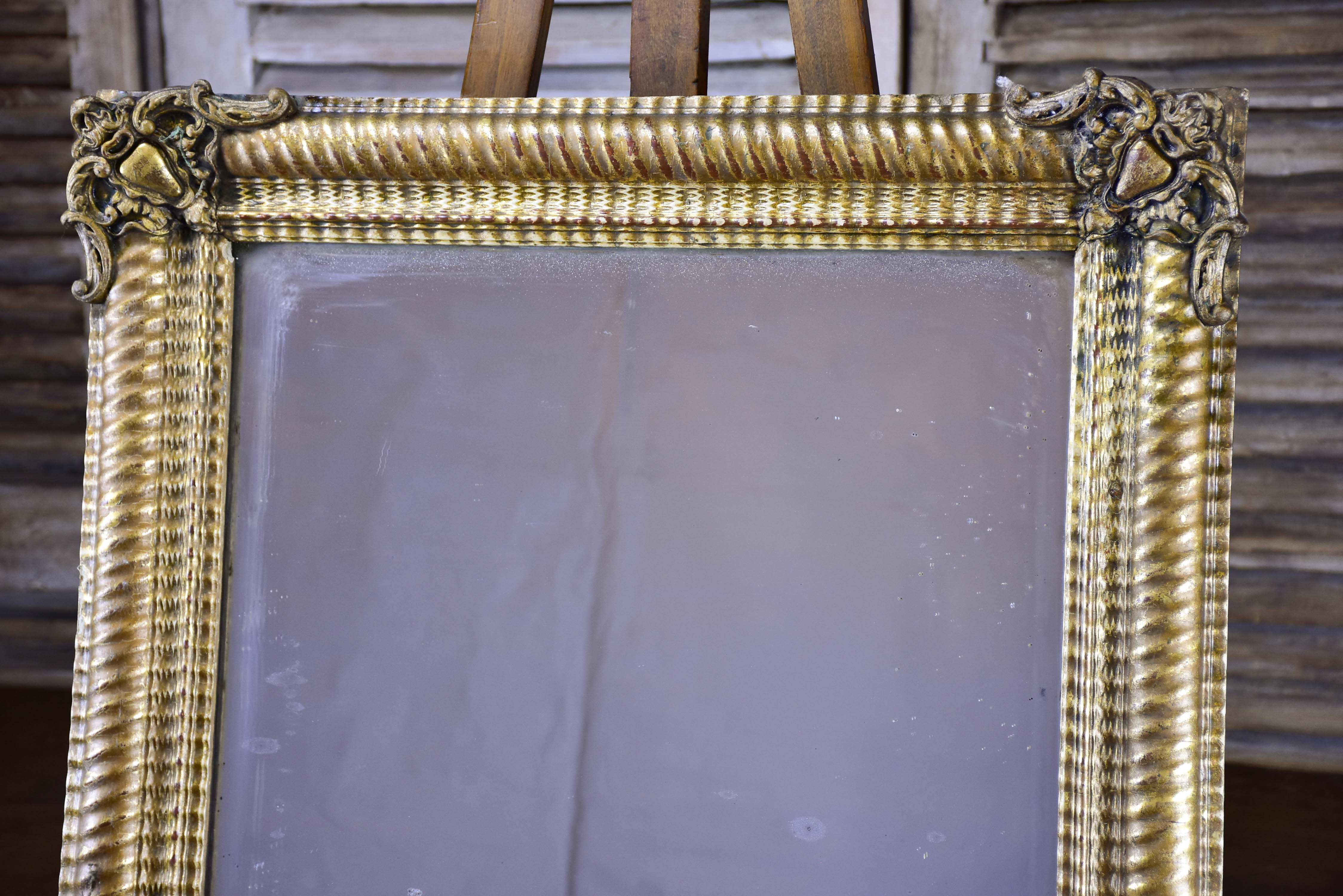 Antique French mirror with gold gadrooned frame