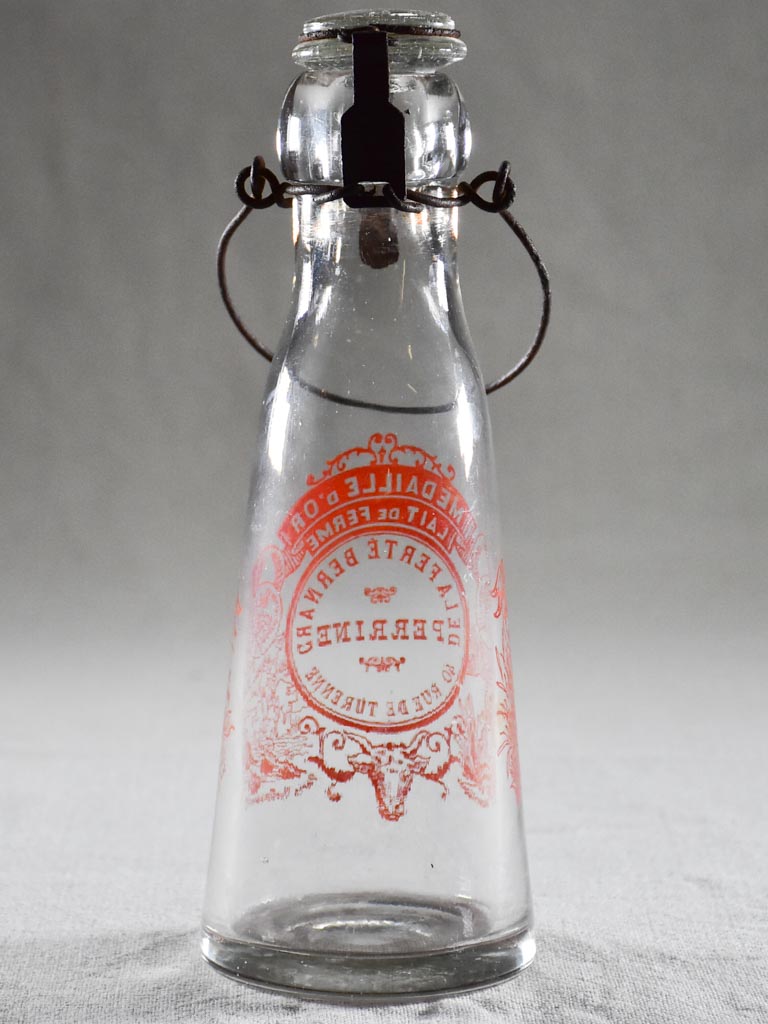 Antique French milk bottle with red transfer label 9¾"