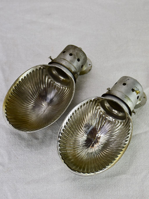 Pair of mid century holophane wall sconces from a boutique