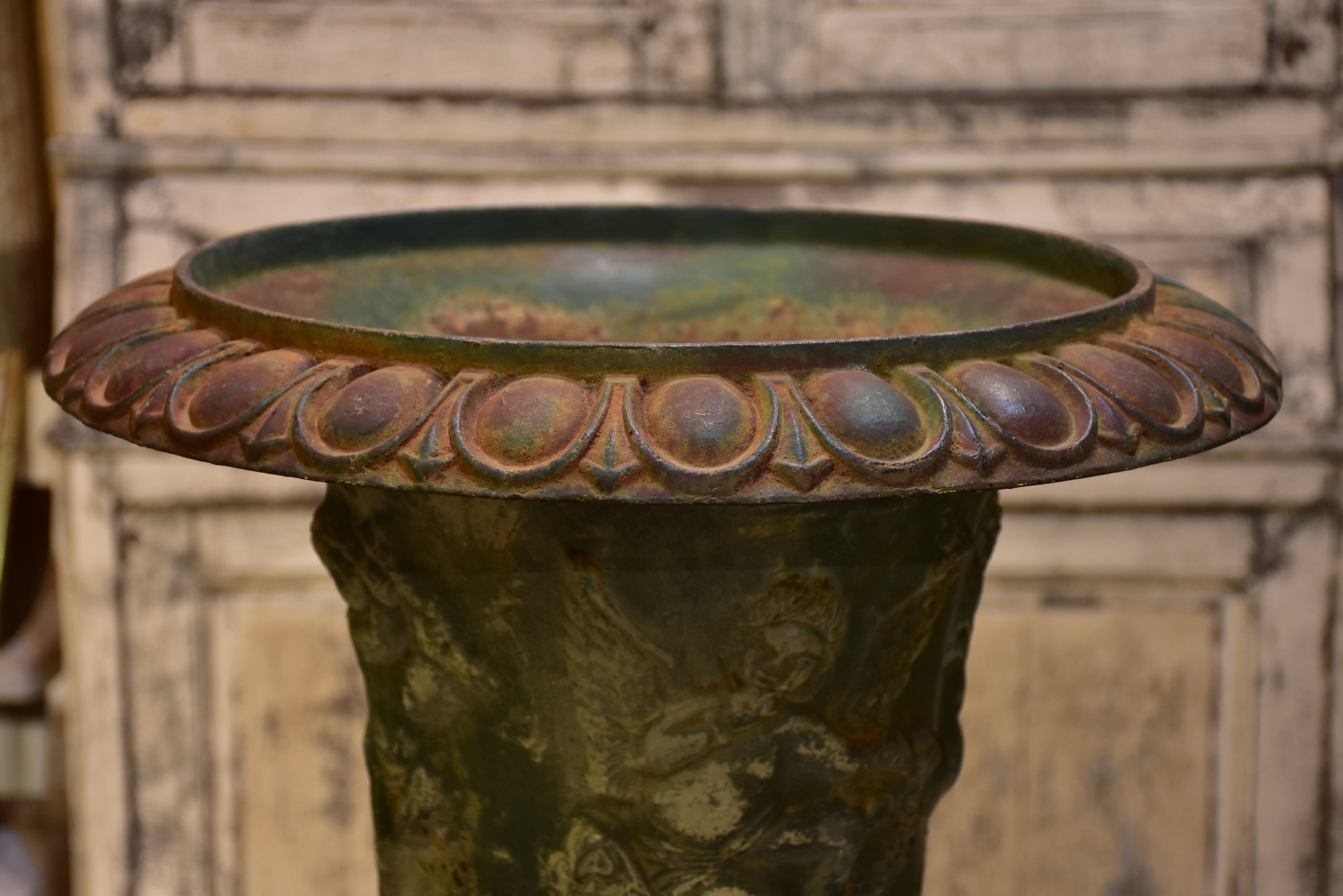 Late 19th century garden urn with angels and green patina