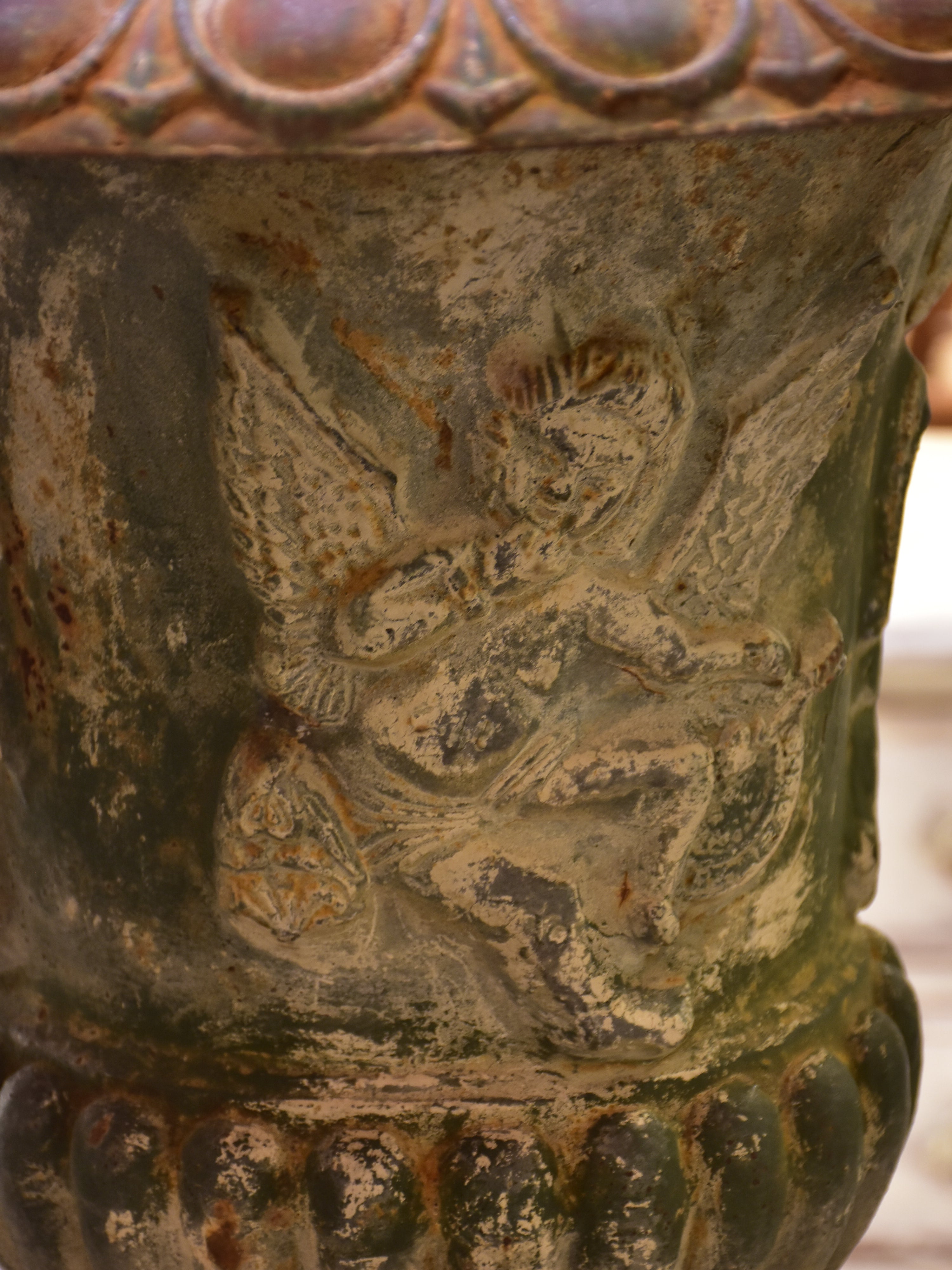 Late 19th century garden urn with angels and green patina