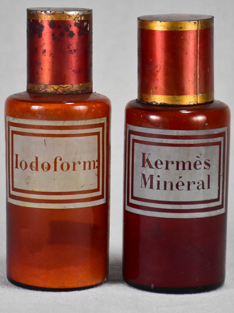 Two late nineteenth-century French apothecary jars with red tin lids 8¼"