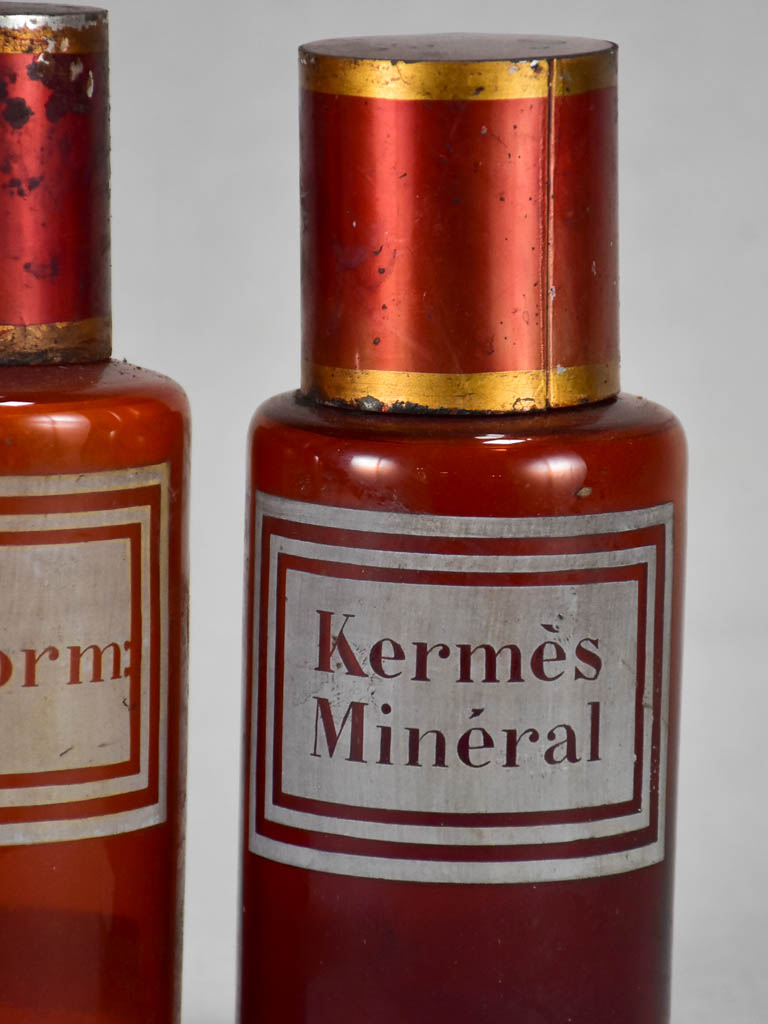 Two late nineteenth-century French apothecary jars with red tin lids 8¼"