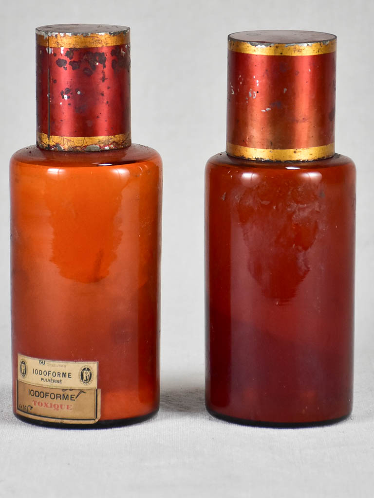 Two late nineteenth-century French apothecary jars with red tin lids 8¼"