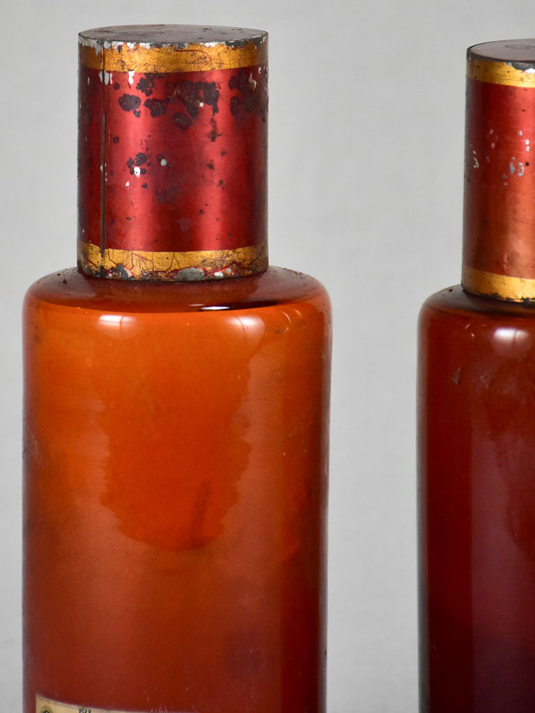 Two late nineteenth-century French apothecary jars with red tin lids 8¼"