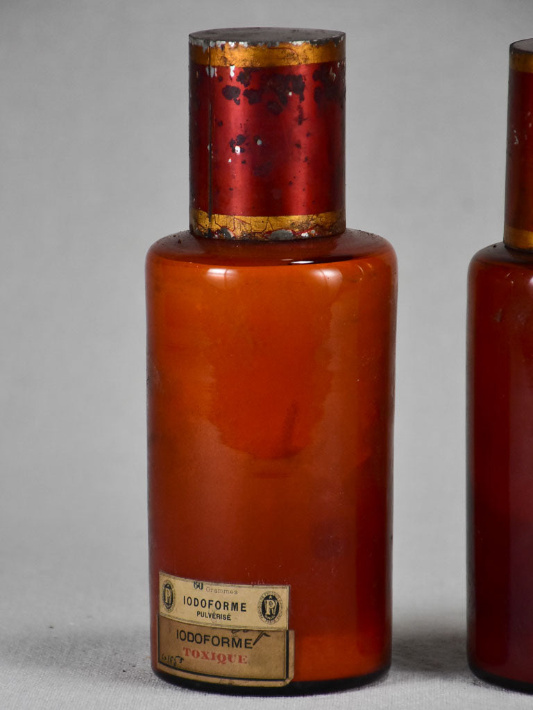 Two late nineteenth-century French apothecary jars with red tin lids 8¼"