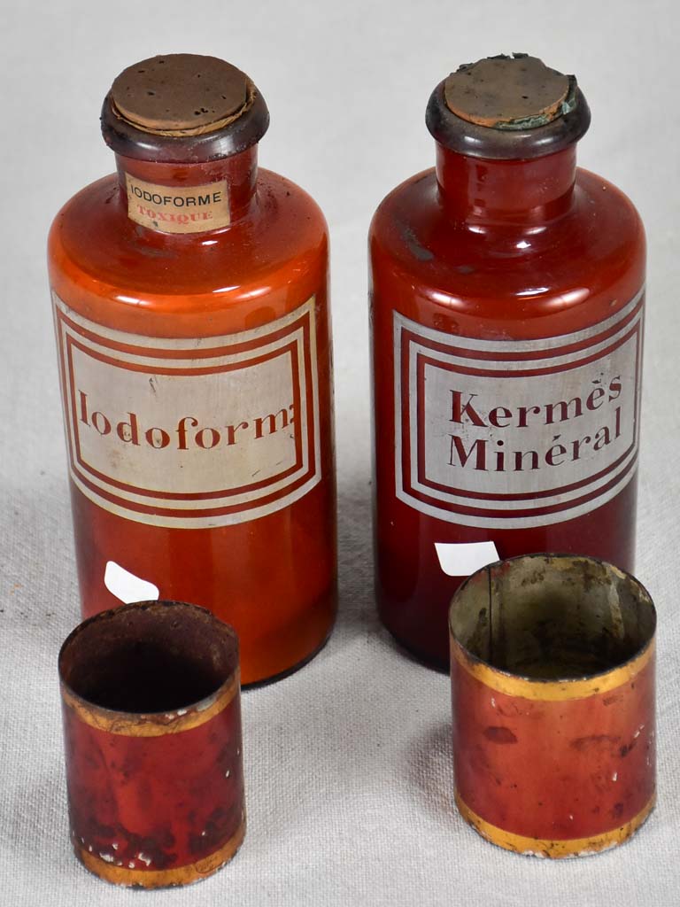 Two late nineteenth-century French apothecary jars with red tin lids 8¼"