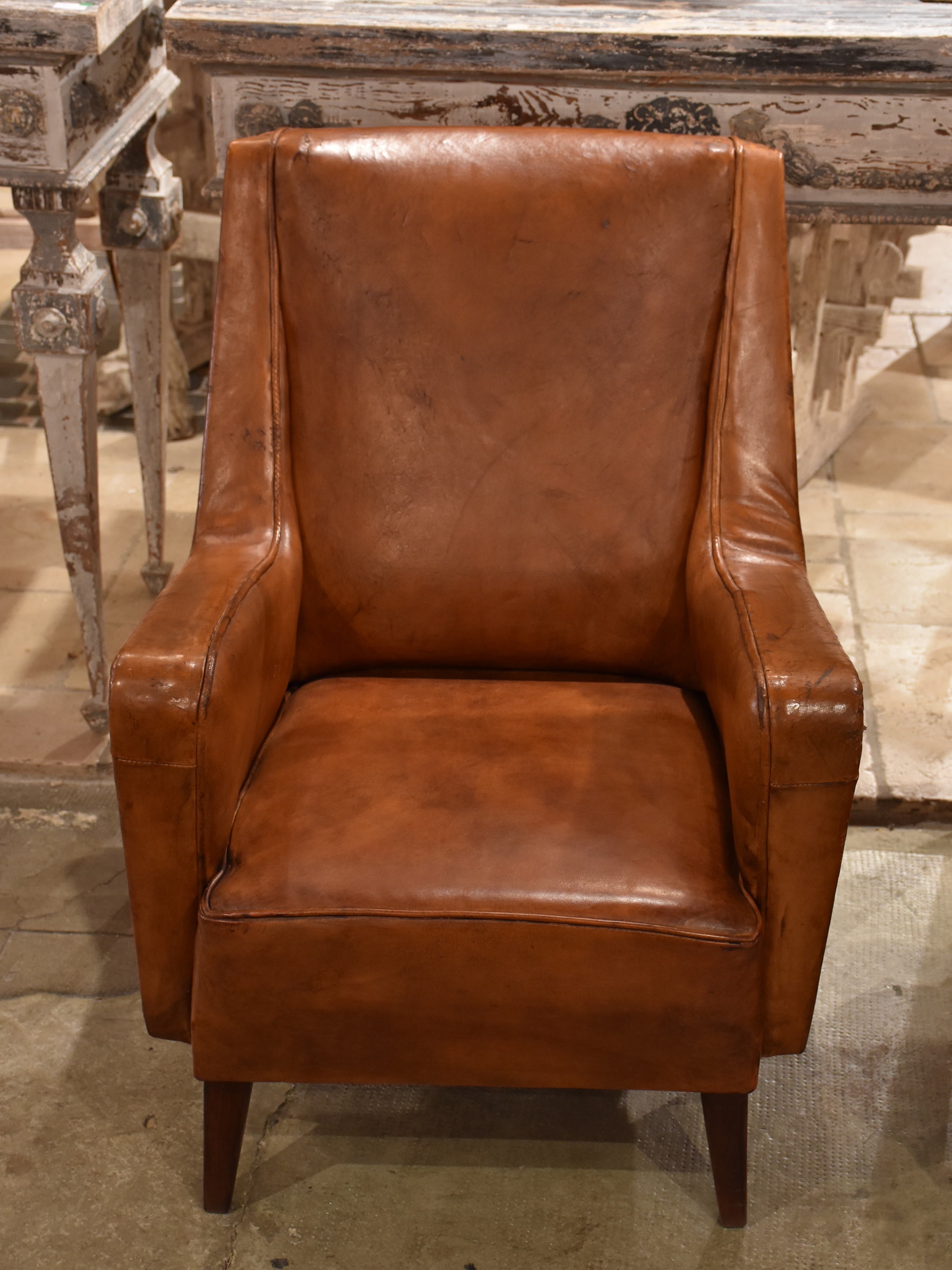 Pair of petite 1960’s leather French armchairs