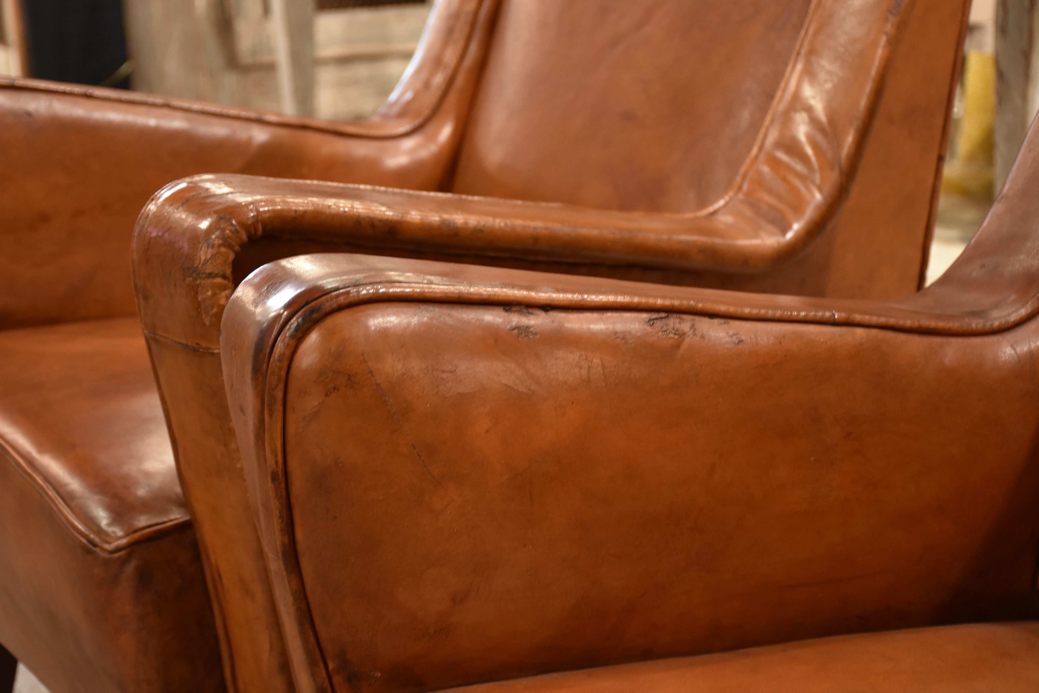 Pair of petite 1960’s leather French armchairs