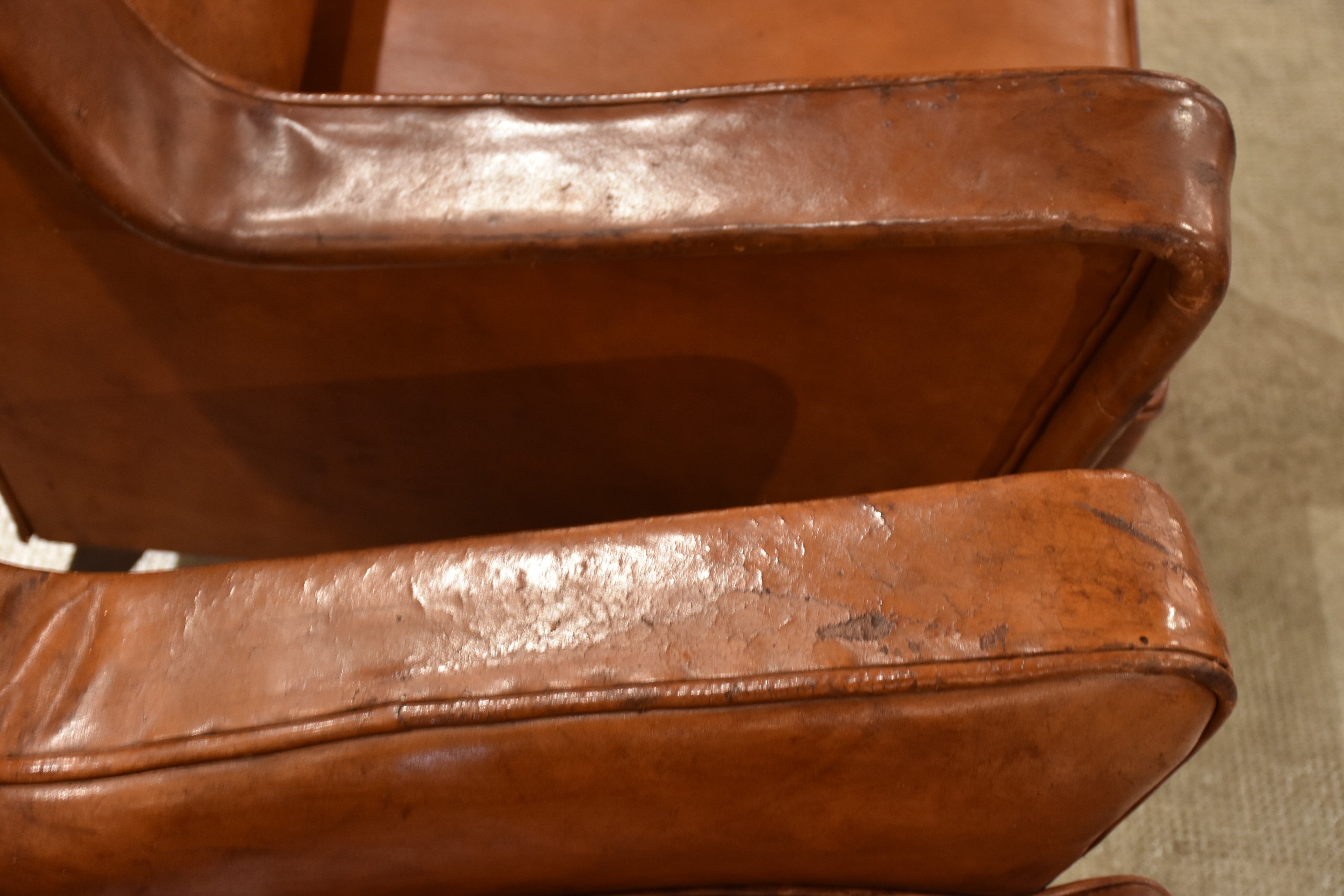 Pair of petite 1960’s leather French armchairs