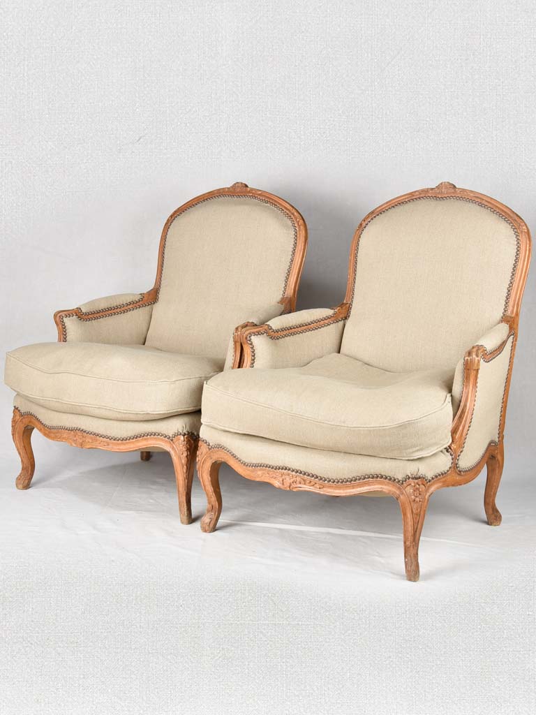 Large pair of 19th century Bergere armchairs with new linen uphostery