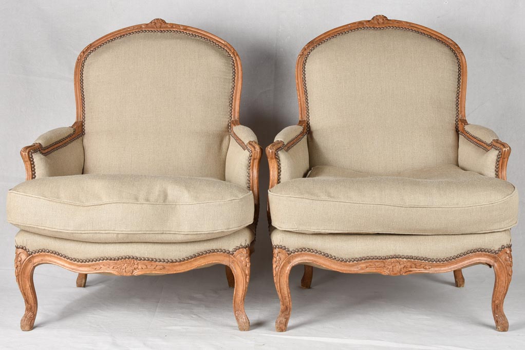 Large pair of 19th century Bergere armchairs with new linen uphostery