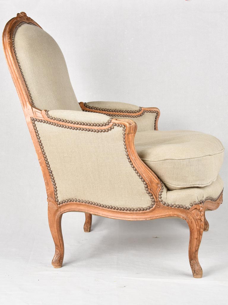 Large pair of 19th century Bergere armchairs with new linen uphostery