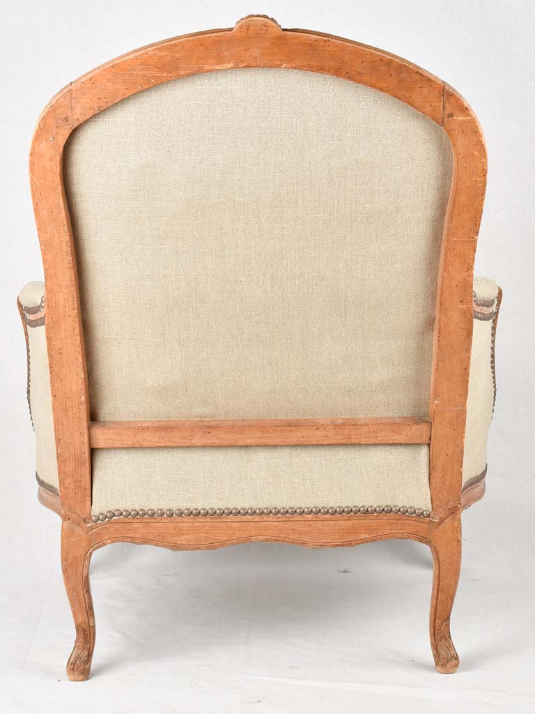 Large pair of 19th century Bergere armchairs with new linen uphostery